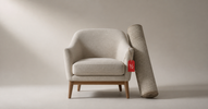 Mid-century armchair with a rolled rug and a red half-price tag — open-box furniture and home decor deals in Canada