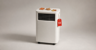 Portable air conditioner with autumn leaves and a red half-price tag — best time to buy an AC in Canada