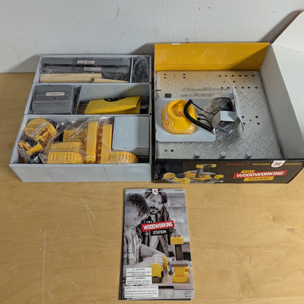 Actual unit: box contents with tools, wood pieces and guide