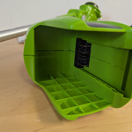 Greenworks STF305 empty battery bay — no battery and no charger are included