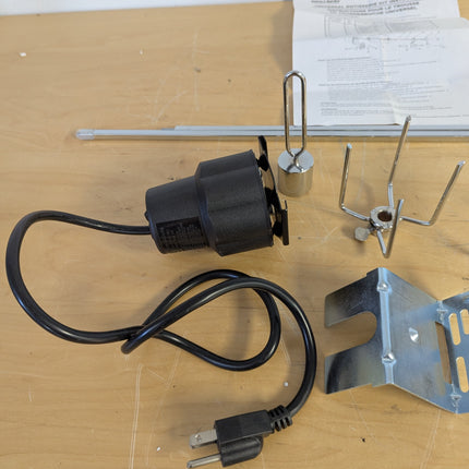Actual unit: GrillSpot rotisserie kit with motor, spit rod, forks and brackets