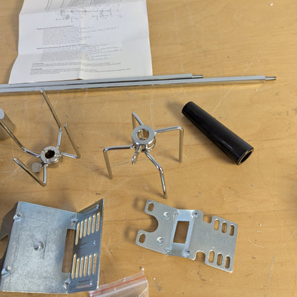 Actual unit: GrillSpot rotisserie kit with motor, spit rod, forks and brackets