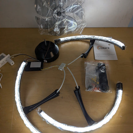 Actual unit: Linboro ceiling fan with LED rings lit, blades and remote in bags
