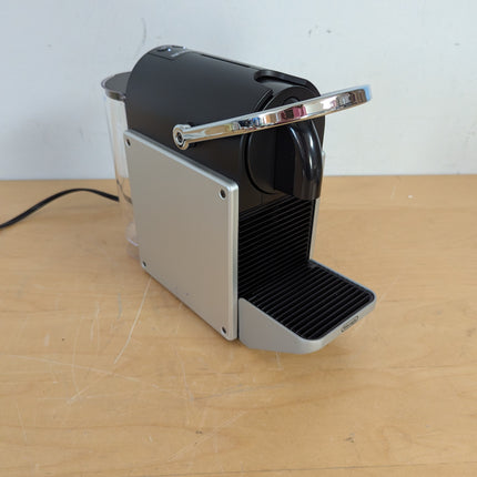 Actual unit: Nespresso Pixie espresso machine by Breville, titan with silver side panels