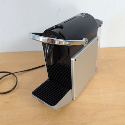 Actual unit: Nespresso Pixie espresso machine by Breville, titan with silver side panels