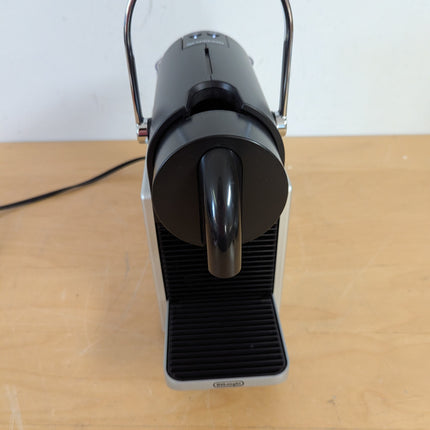 Actual unit: Nespresso Pixie espresso machine by Breville, titan with silver side panels