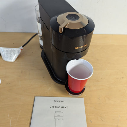 Actual unit: Nespresso Vertuo Next by De'Longhi, black with rose gold