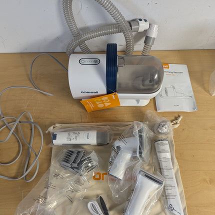 Actual unit: oneisall LM2 grooming vacuum with clipper, combs and tools