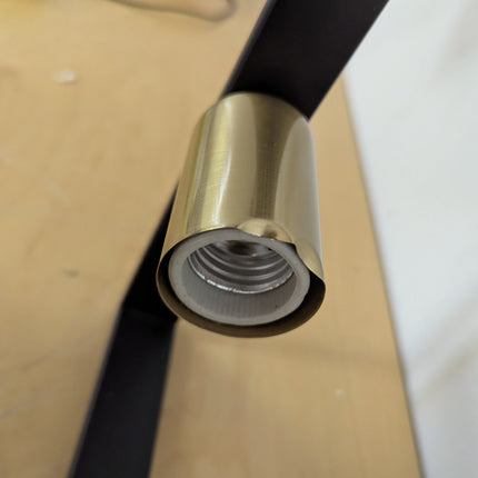Actual unit: marks on a brass-tone socket cover