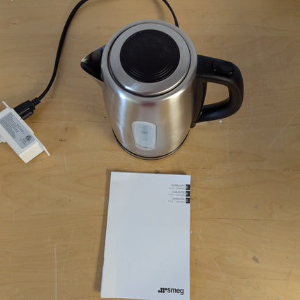 Actual unit: Salton JK1903 stainless steel cordless kettle on its power base